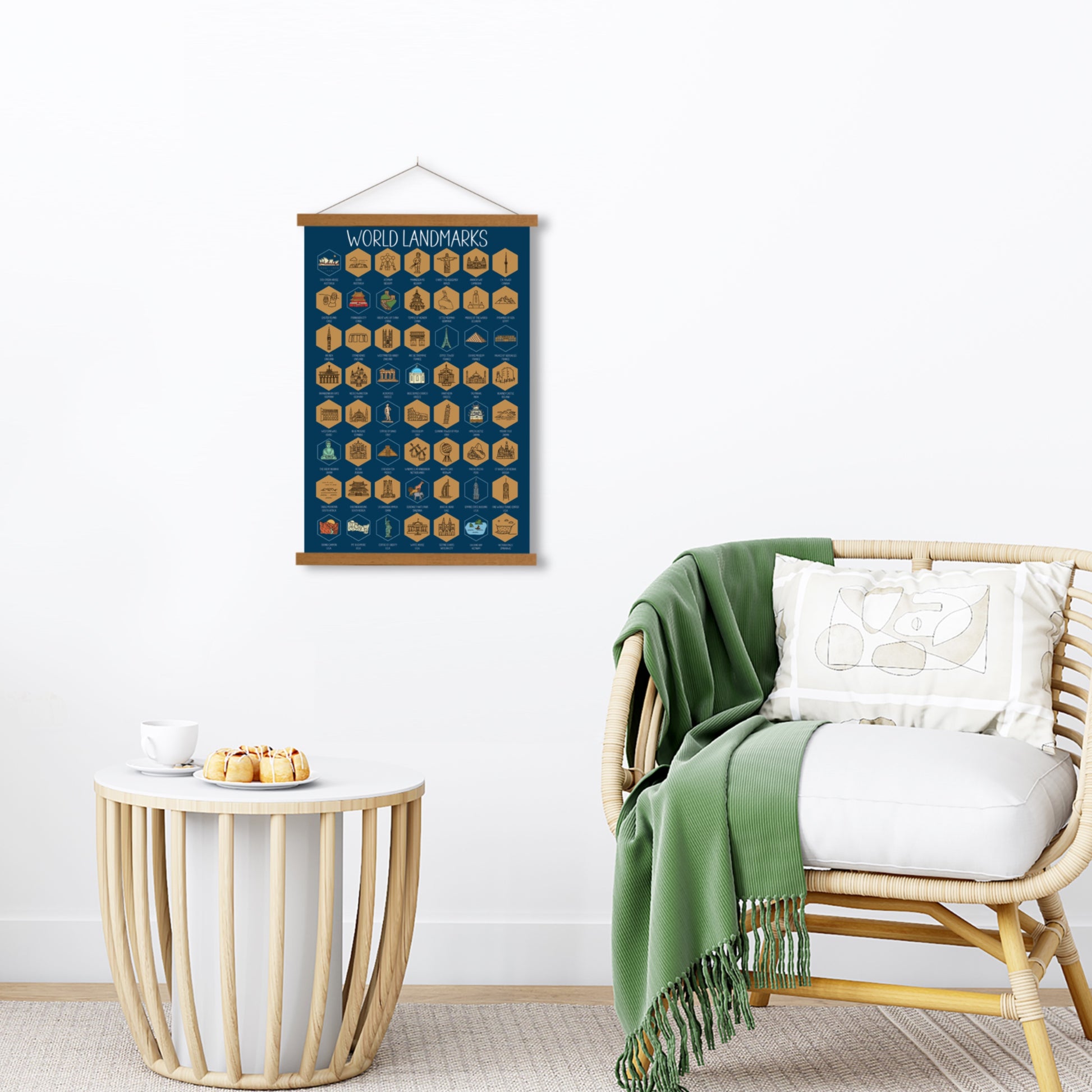 World Landmarks scratch off poster. Has a navy background with colorful icons for each landmark. Scratch off a gold layer to reveal artwork. Hanging on a wooden frame on a wall.