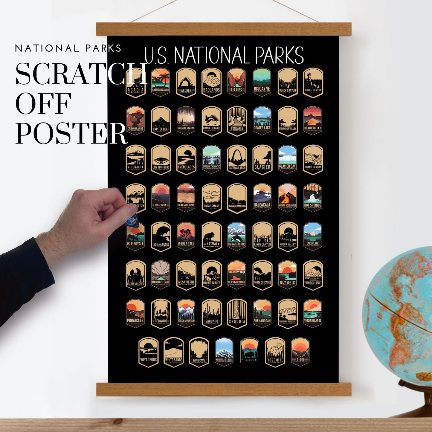63 National Park scratch off poster, Has a black background with colorful icons for each park. Scratch off a gold layer to reveal artwork. Hanging on a wooden frame.