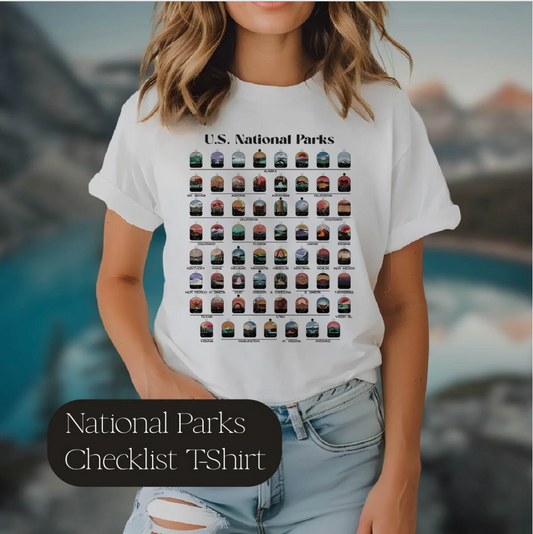 Woman wearing white t-shirt with all 63 National Parks on it with circles to fill in to track your National Parks.