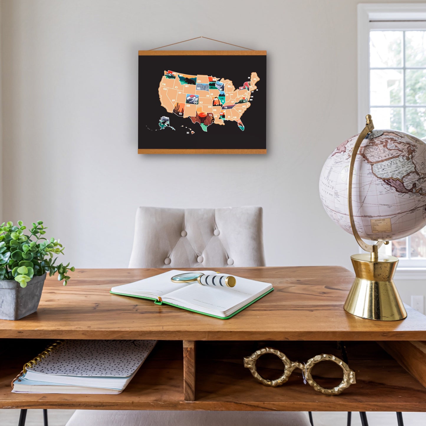USA Map with Black background. hanging on an office wall. Each state has a icon representing the state. Gold Overlay scratches off to reveal artwork underneath.
