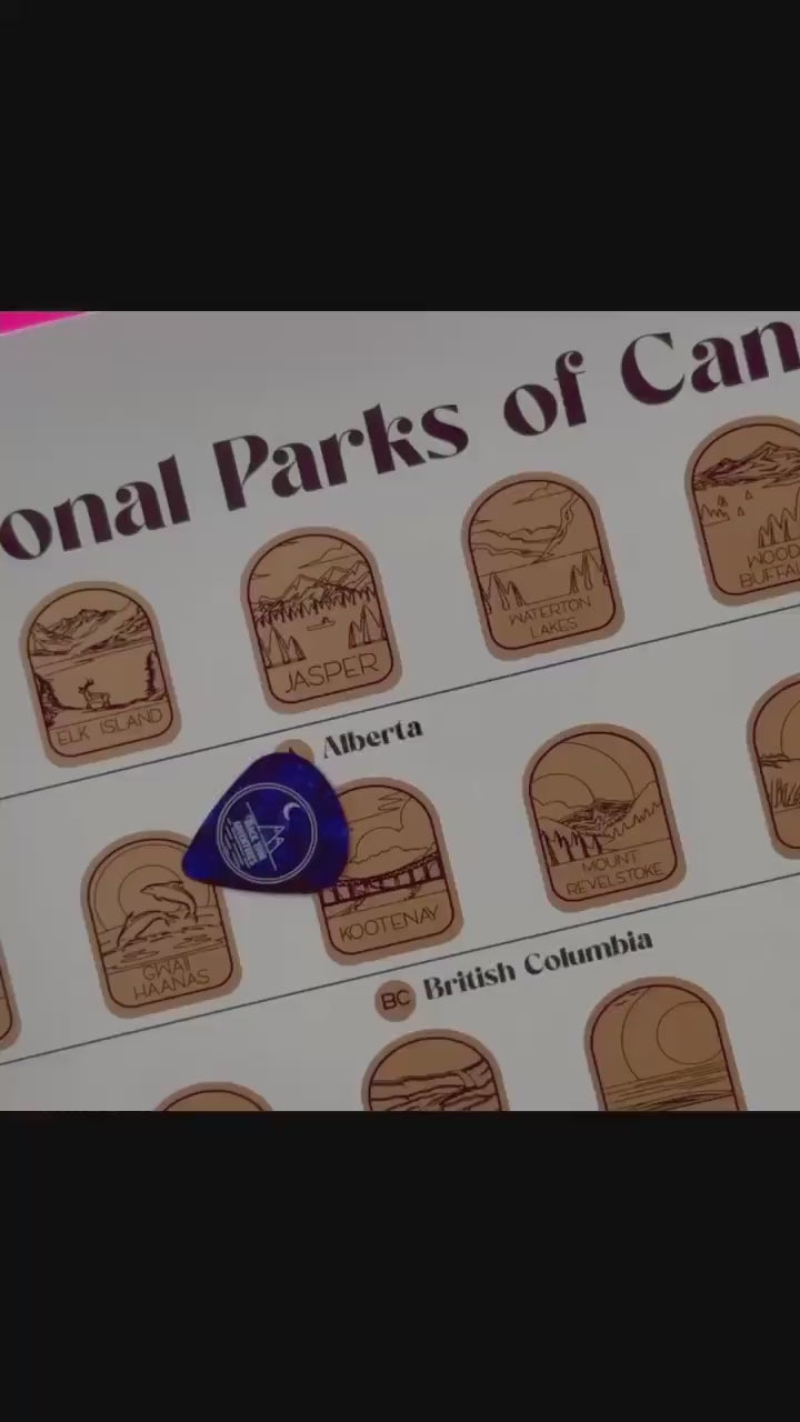 Video of someone scratching off the top gold layer on the Canadian National Parks scratch off poster.